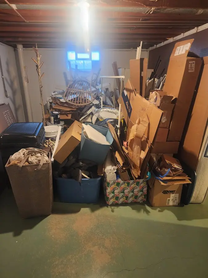 Roll-off dumpster container at job site for 2 Yard Dumpster Rental in Wallace